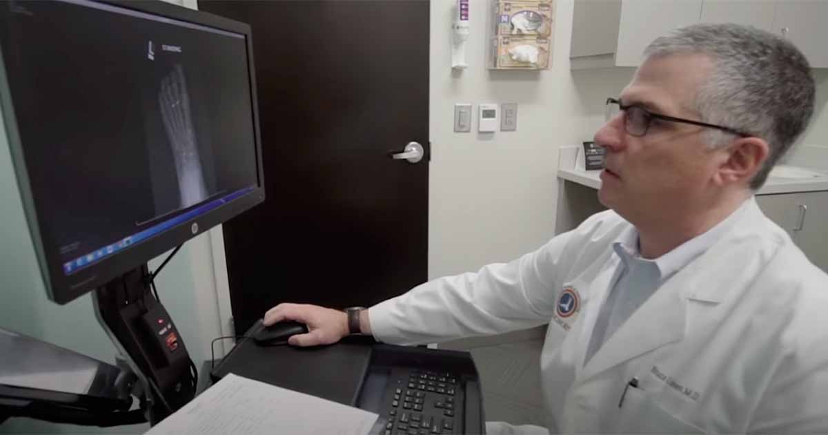 Health professional at desktop computer