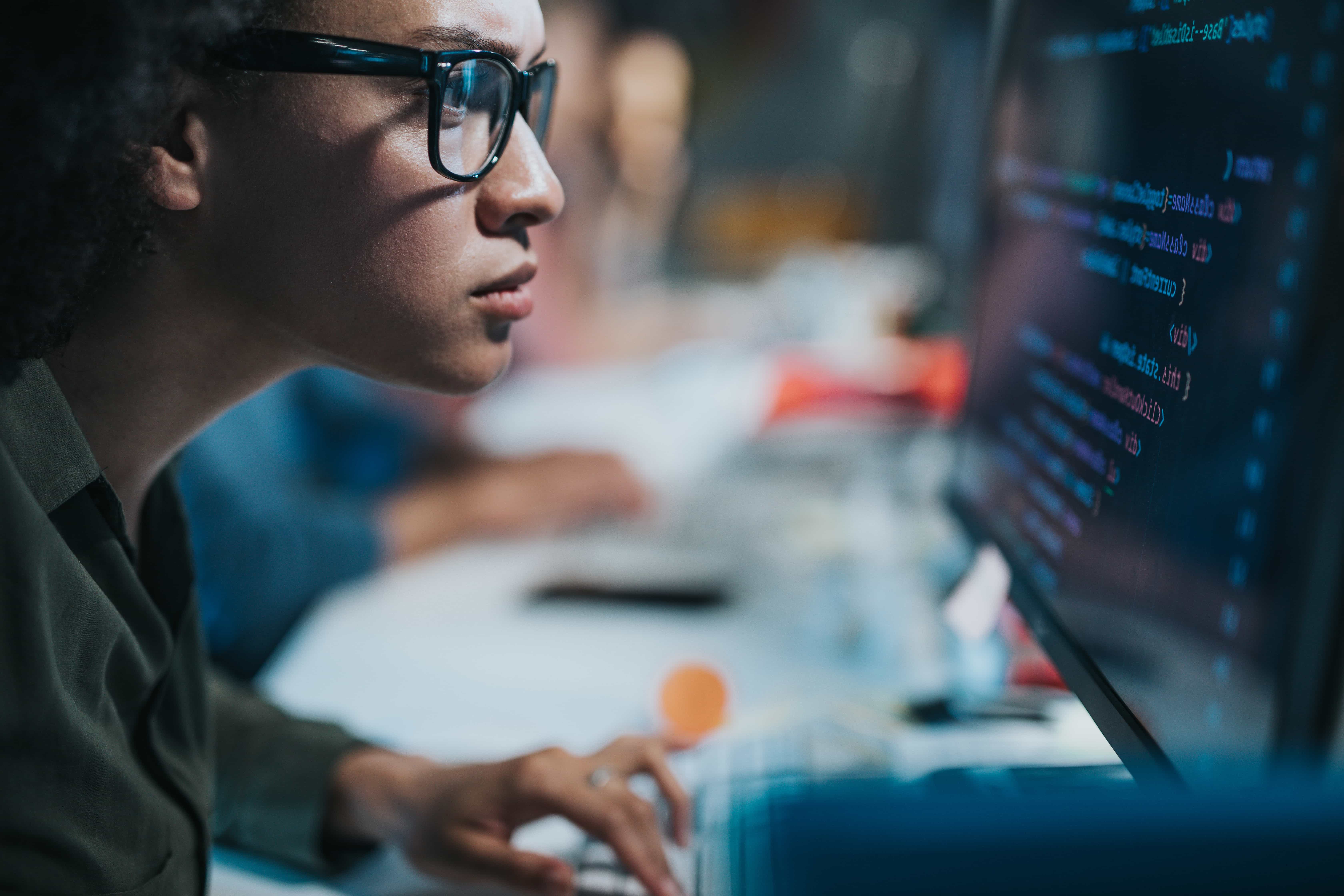 A programmer using a computer.