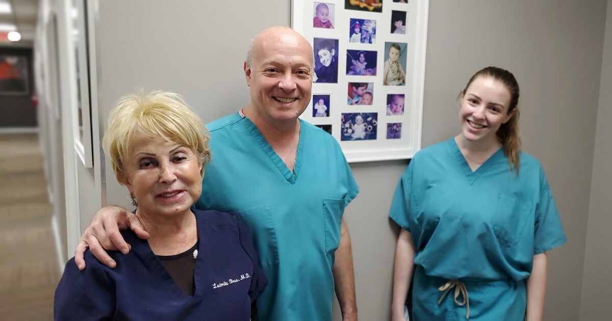 Three smiling medical professionals