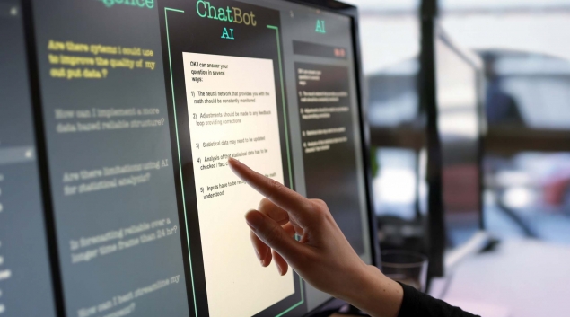 finger pointing to a screen