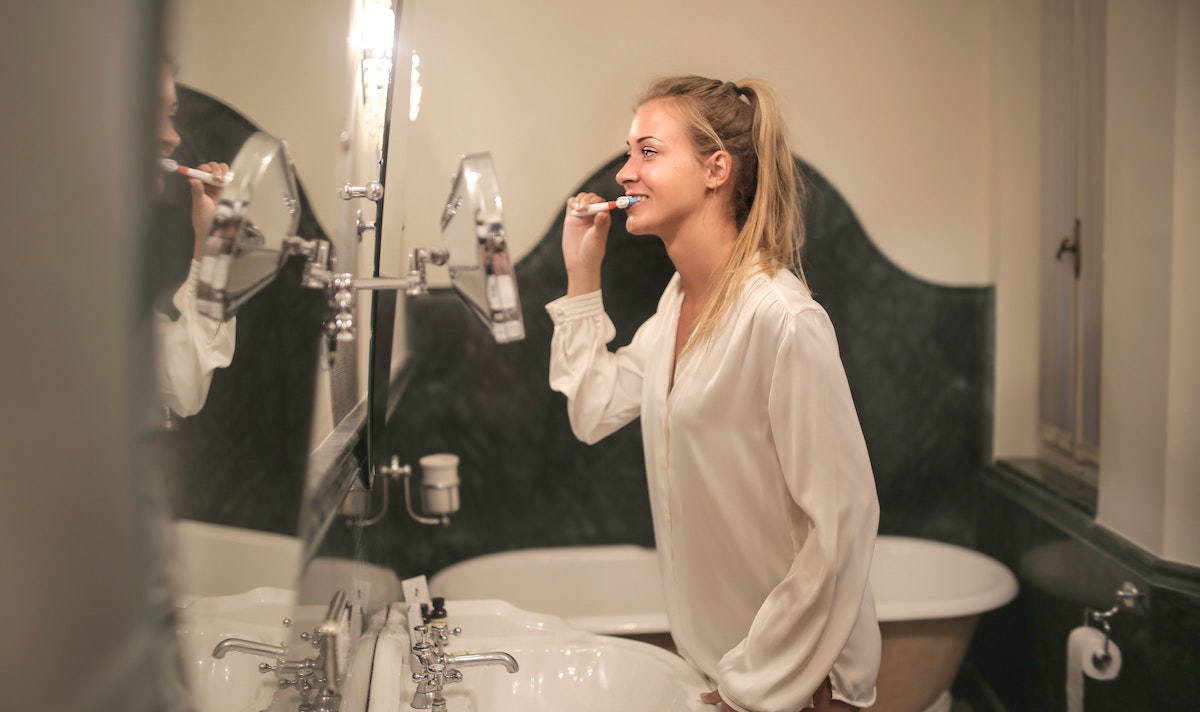 Person brushing teeth