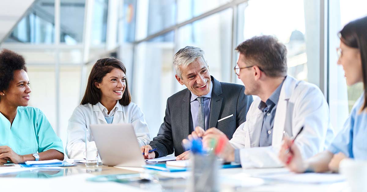 Doctors and businesspeople in a meeting