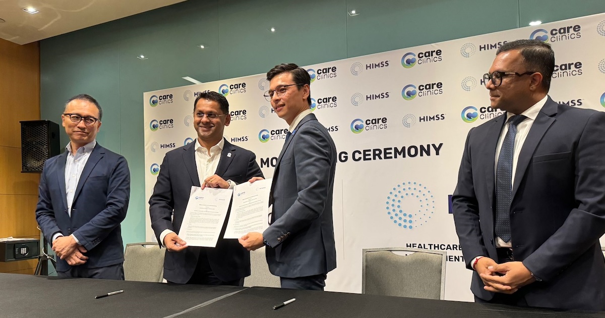 CareClinics and HIMSS representatives during an MOU signing