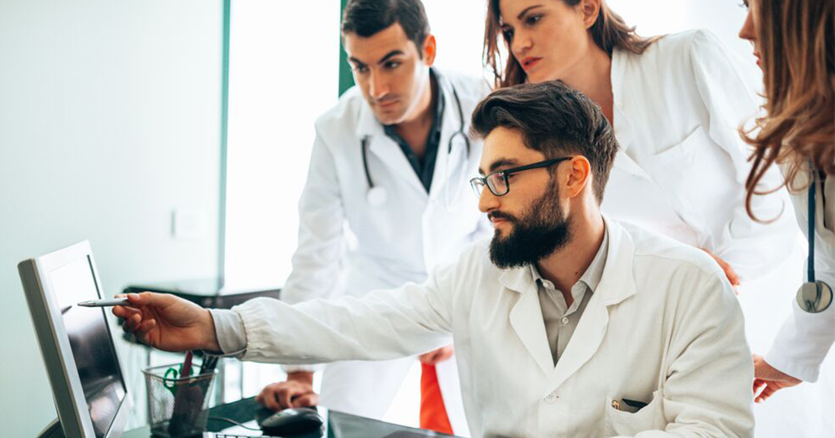 Clinicians at a computer