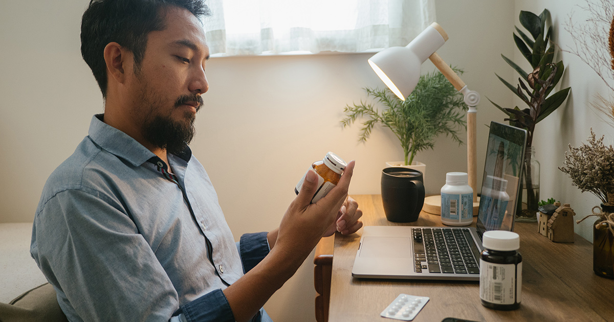 Person looking at perscription bottle