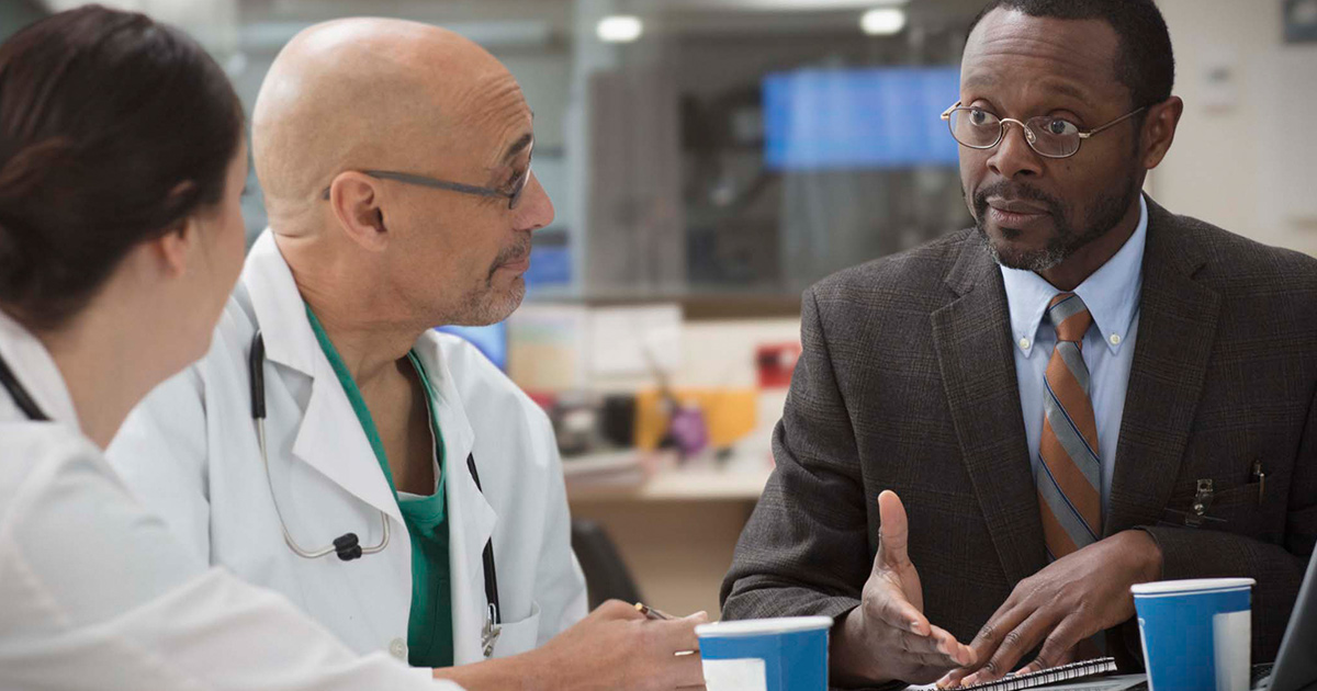 Doctors meeting with executive