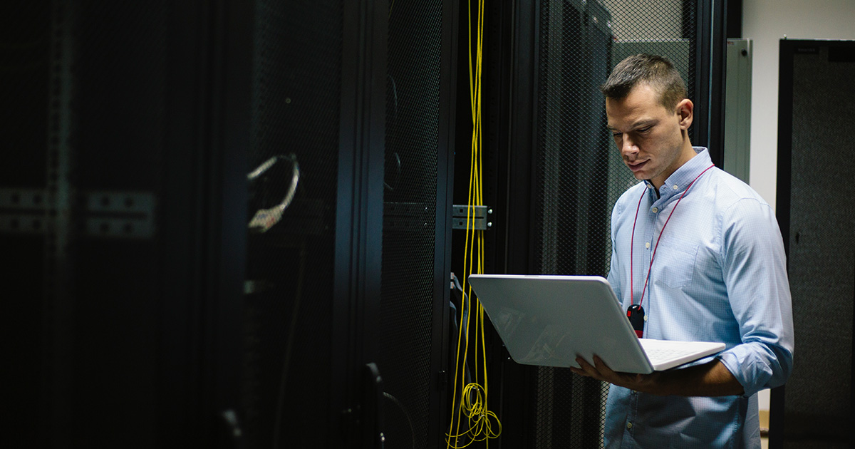 IT worker restores systems in server room
