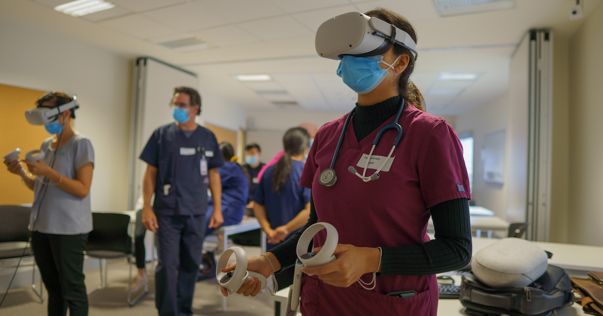 A clinician wearing a VR headset