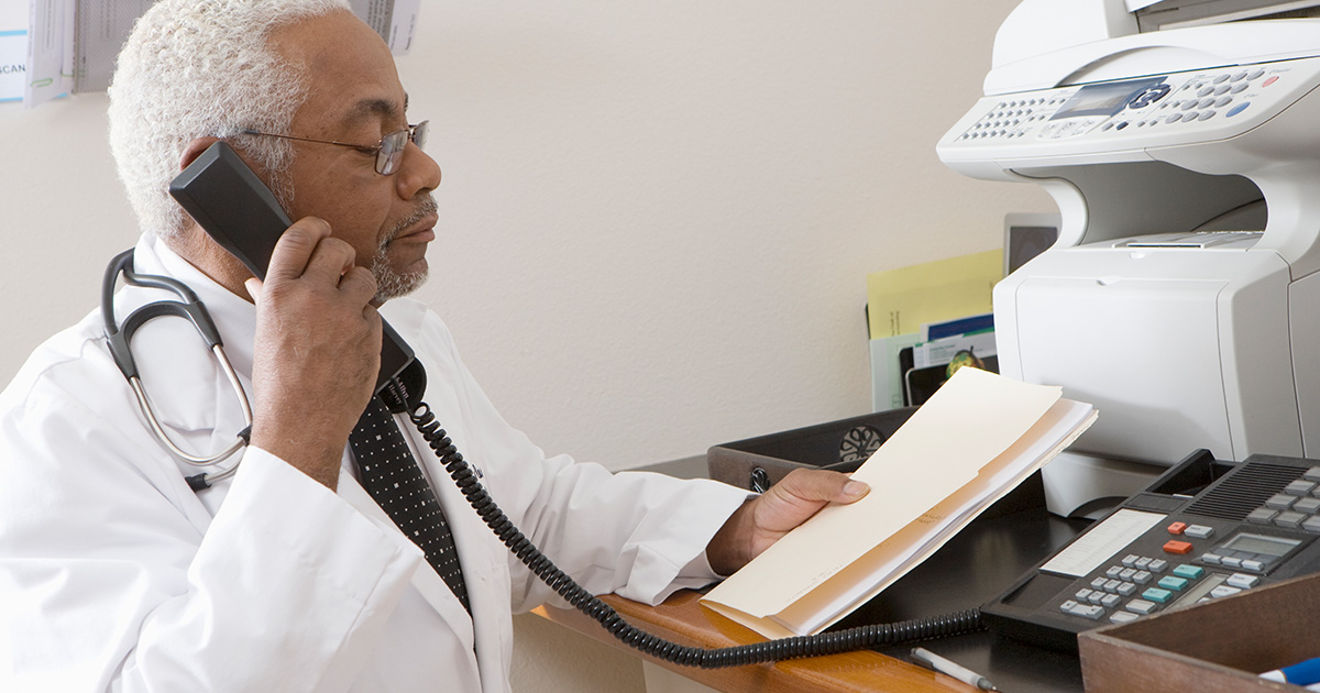 Physician uses fax machine