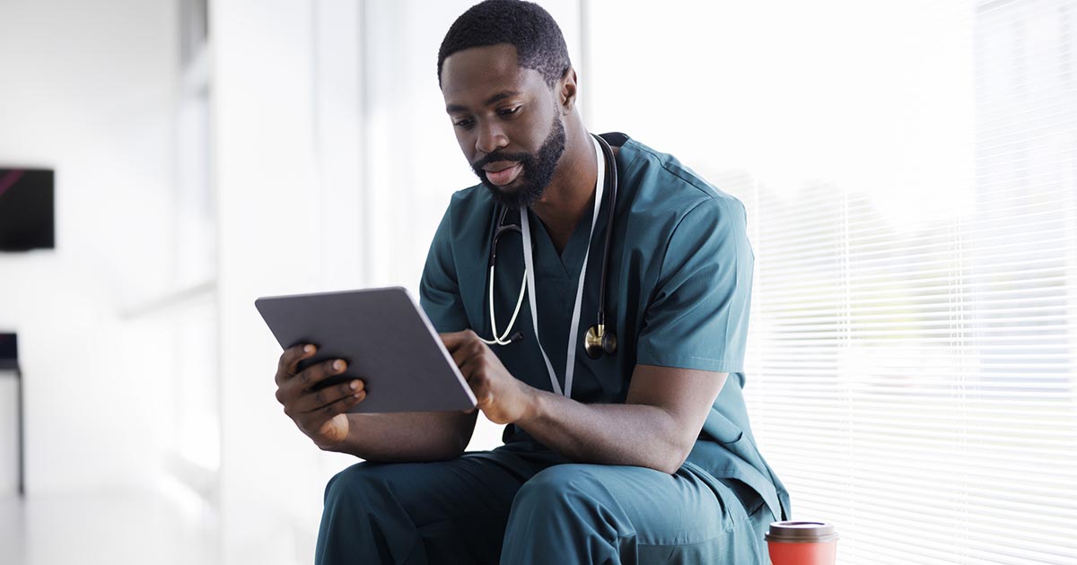 Doctor looking at tablet