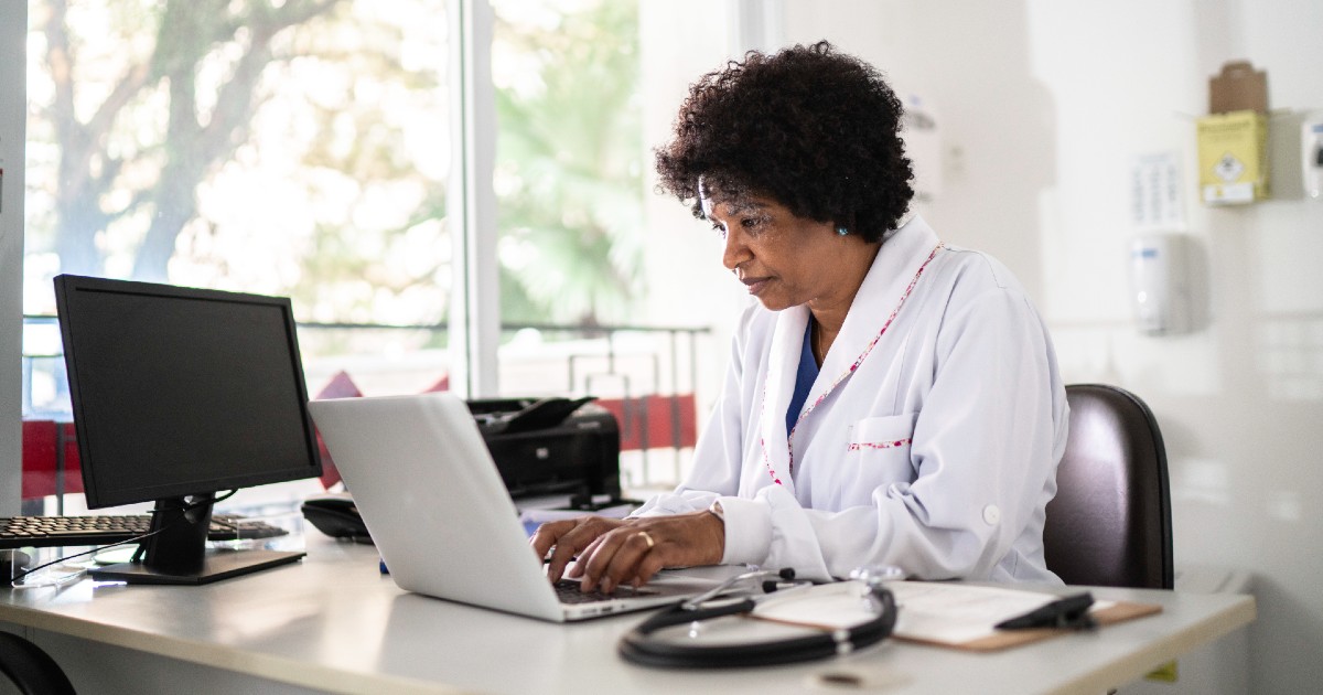 A doctor at a computer