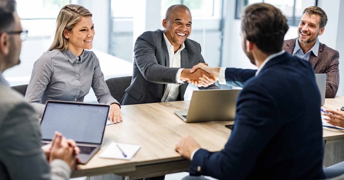 Business people shaking hands at a meeting
