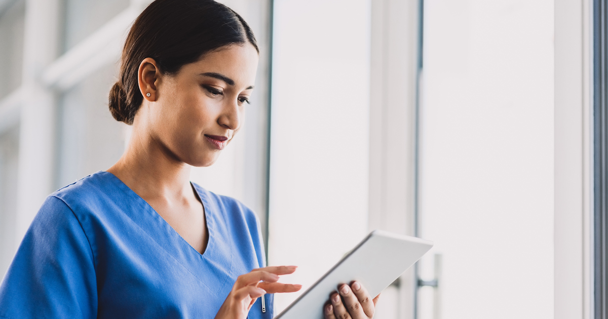 Healthcare worker using tablet