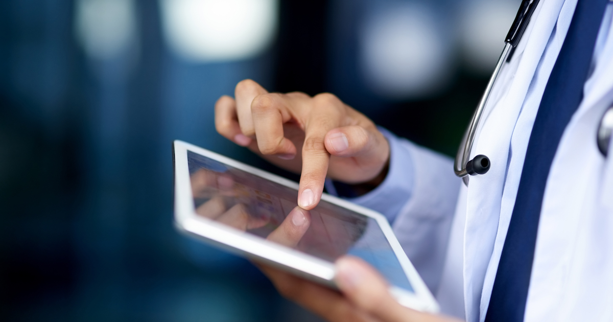 Healthcare worker using tablet