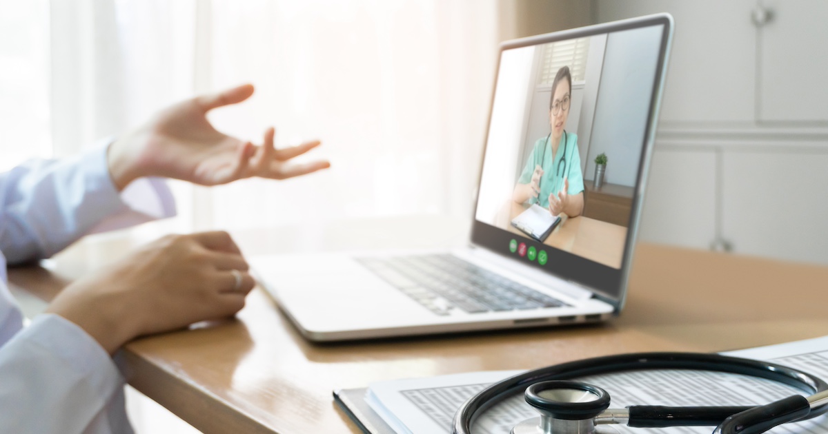 Person talking to doctor on laptop