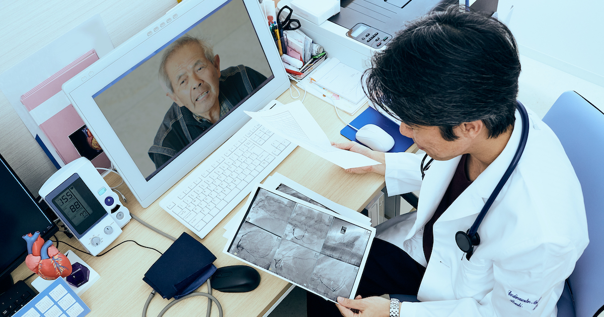 A doctor relaying a patient's heart X-ray findings via teleconsultation