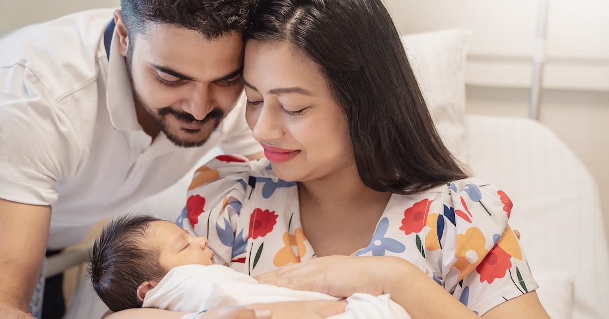 Parents holding a baby