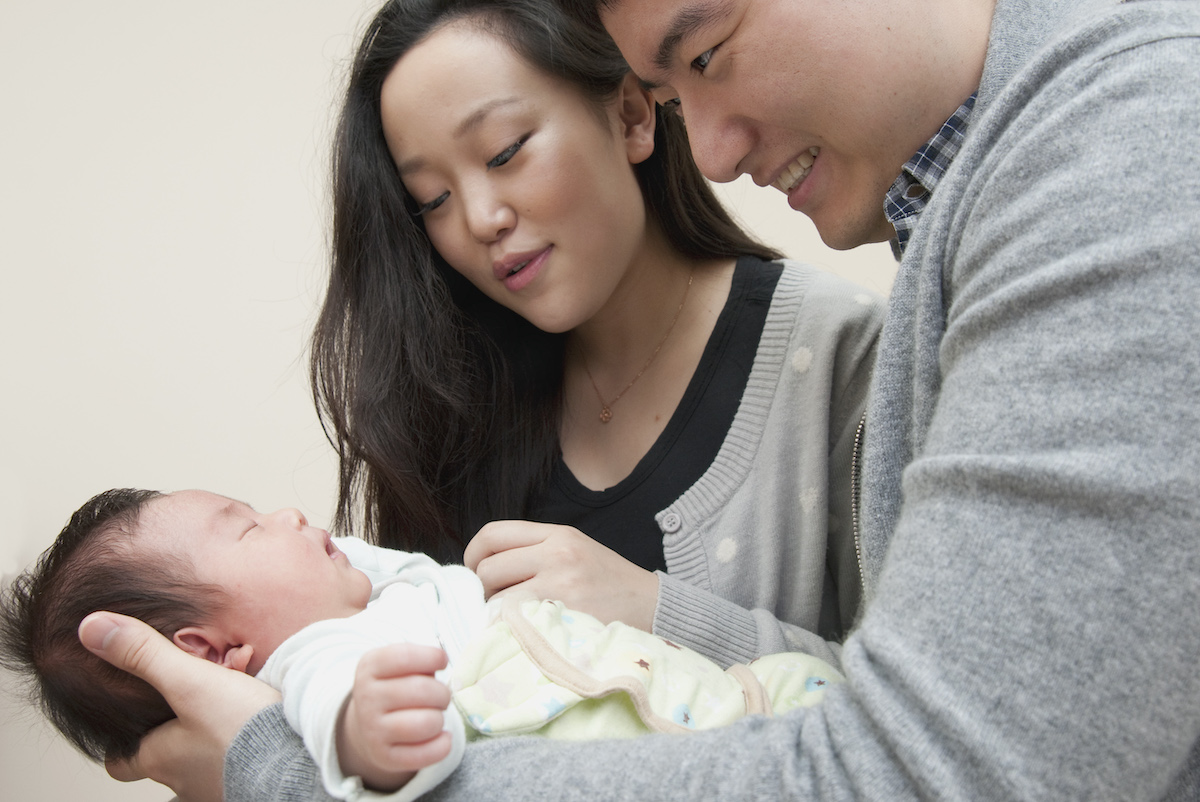 Couple holding baby