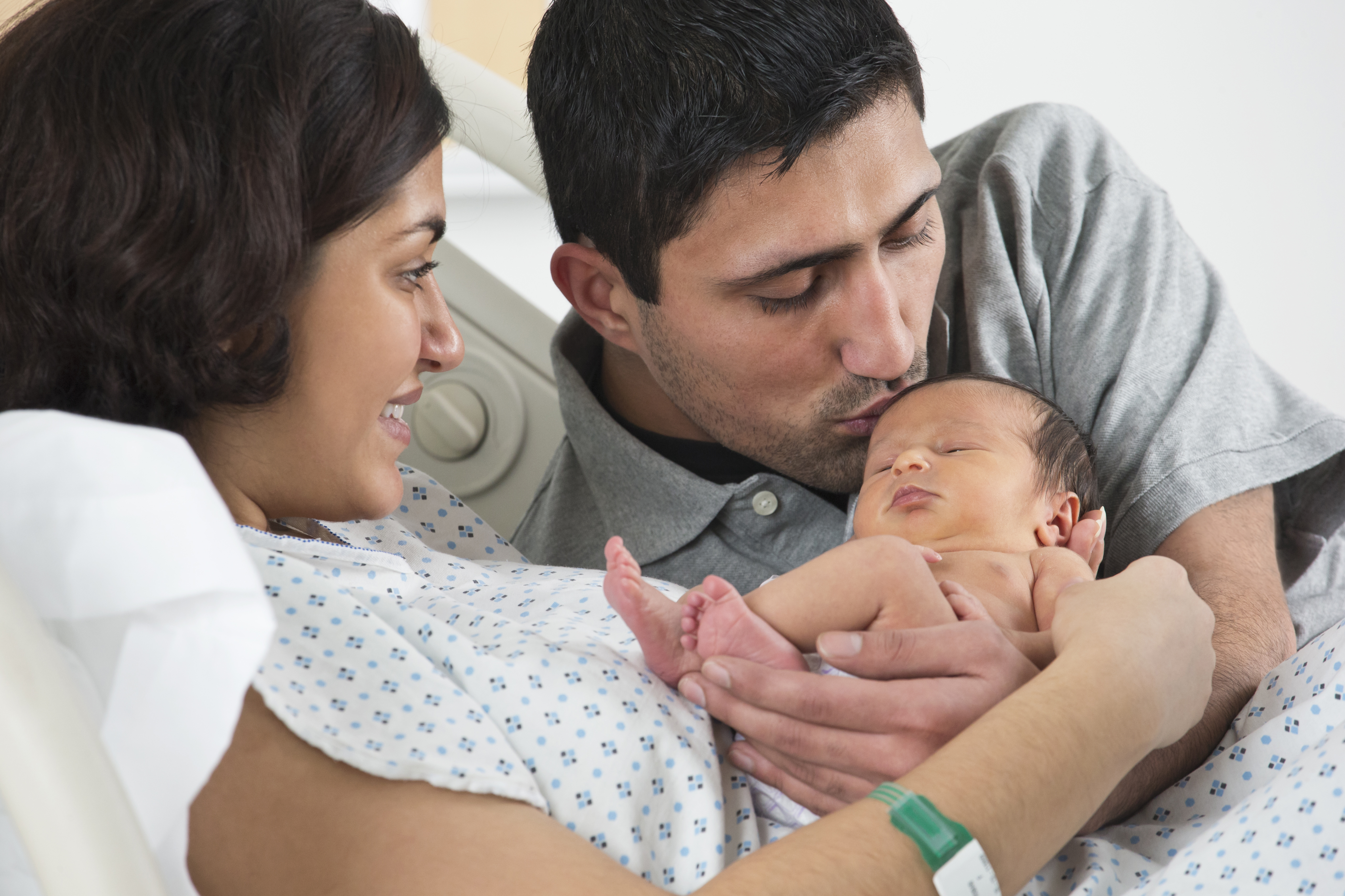 Parents holding newborn baby