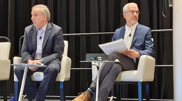 Jeff Coughlin, senior government relations director at HIMSS, left, and  Dr. Steven Lane, clinical informatics director at the Sutter Health Palo Alto Medical Foundation, speak Monday at HIMSS22 in Orlando.