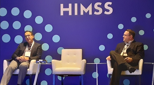 Dr. Steven Waldren, vice president and chief informatics officer at the American Academy of Family Physicians, right, and Dr. Kamel Sadek, director of informatics at Village Medical, speak at the HIMSS22 conference in Orlando.
