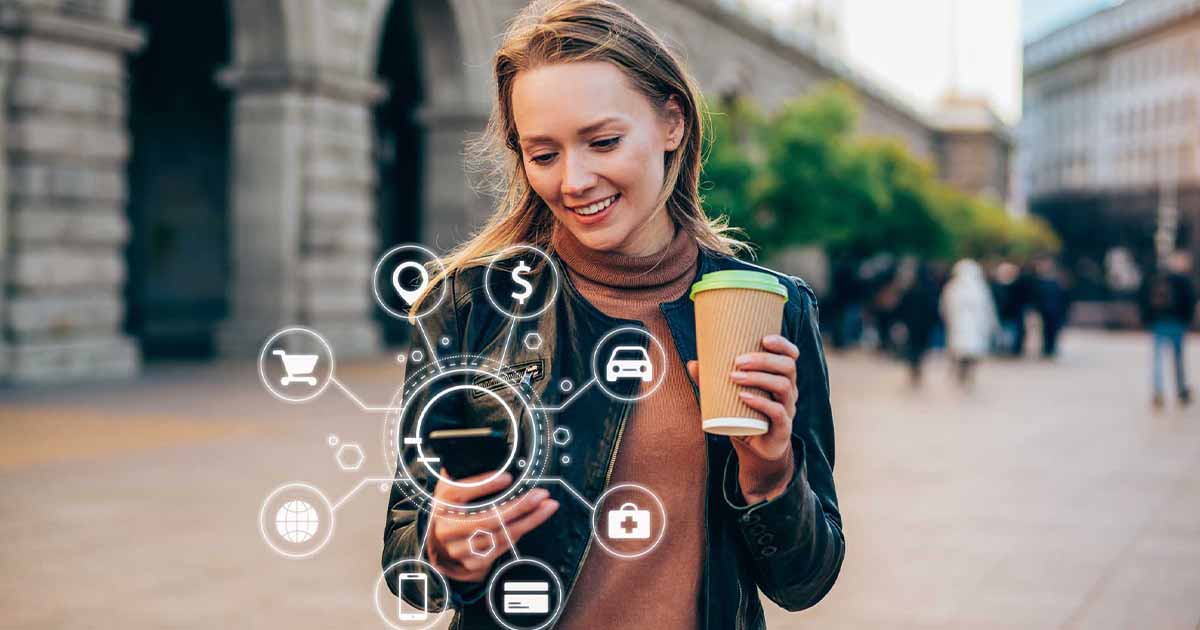 Person using a smartphone with digital overlay of icons