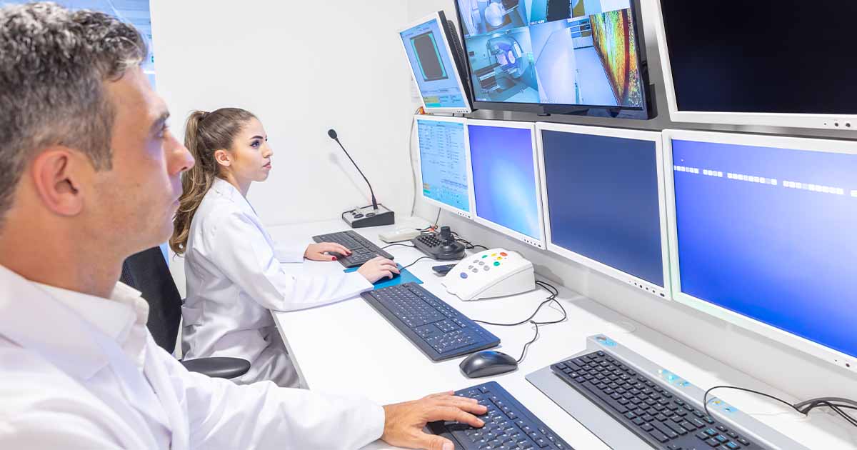 Doctors looking at medical images on a monitor