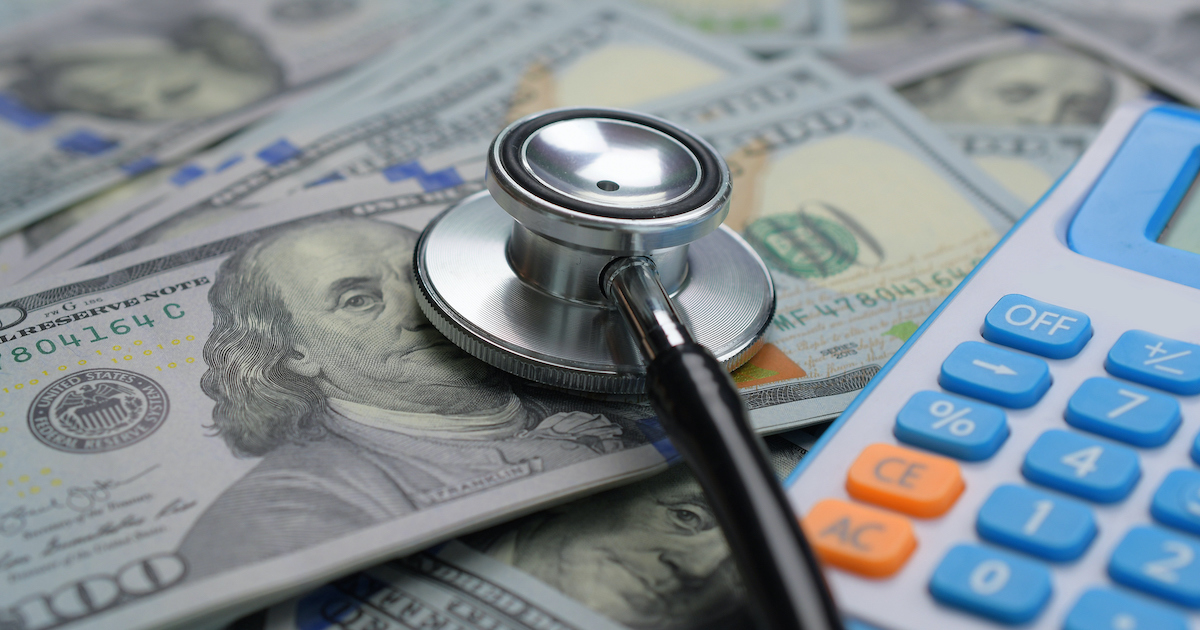 Money, stethoscope and calculator