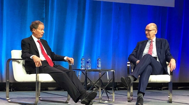 John Mackey, (left) CEO and cofounder of Whole Foods, speaks to Cris Ross, CIO Mayo Clinic, at HIMSS22 in Orlando.