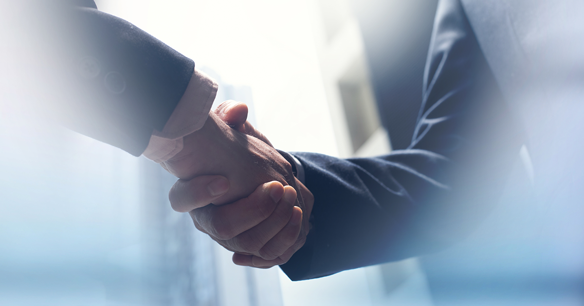 Handshake by people in suits