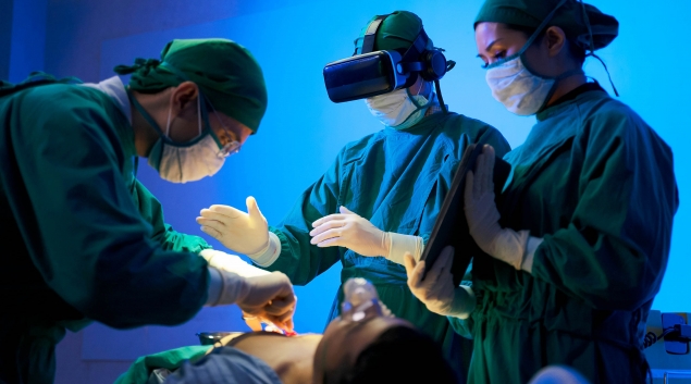 Surgeons working with VR headset