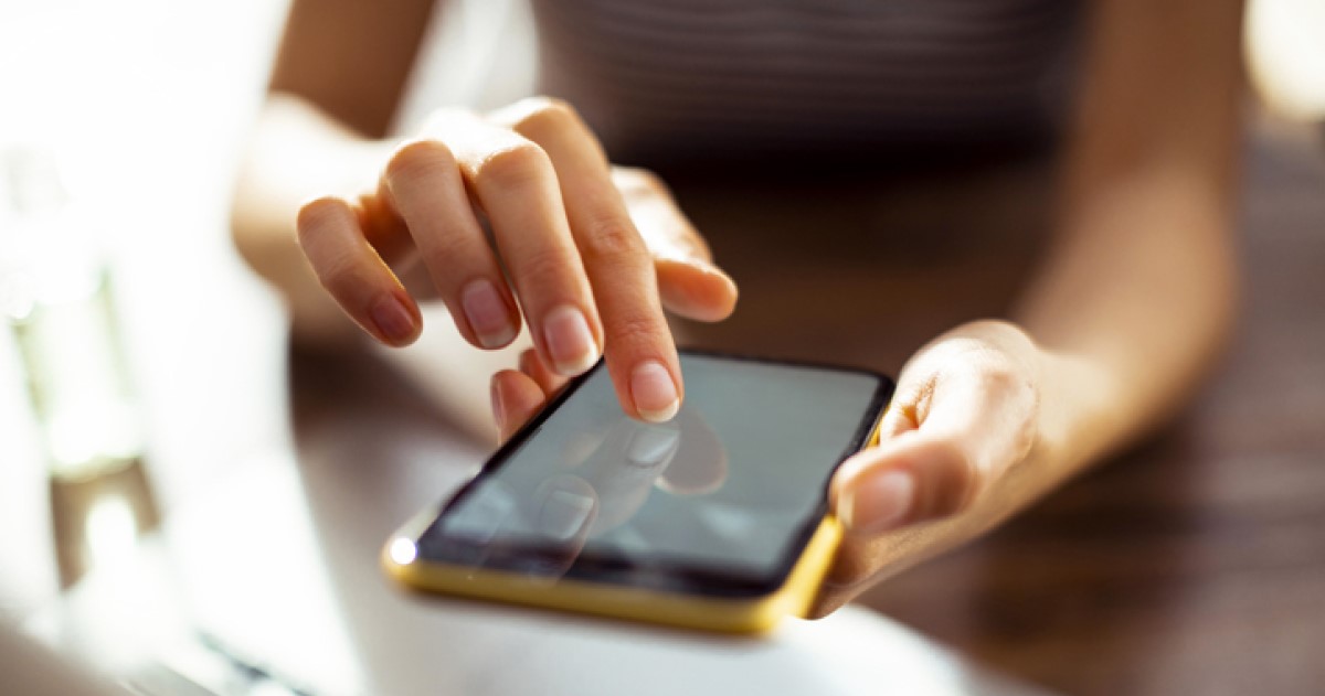 Hands using a cellular device