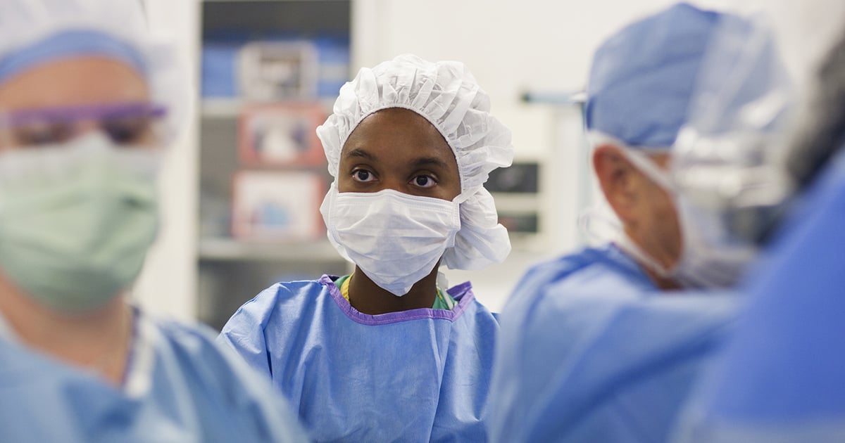 Healthcare workers in scrubs and face masks