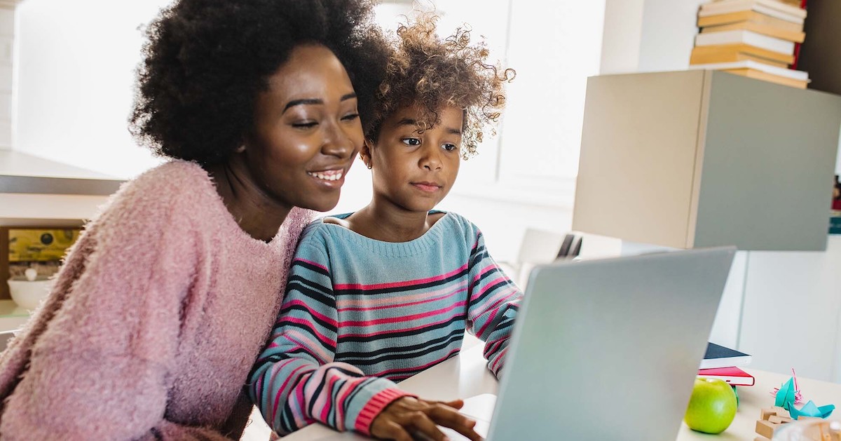 Parent and child using a laptop