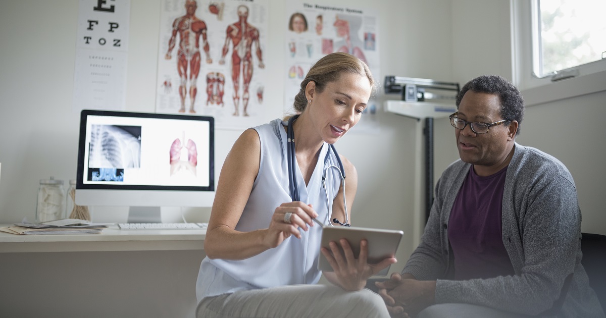 Doctor speaking to patient