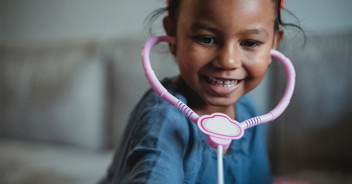 Child with toy stethoscope