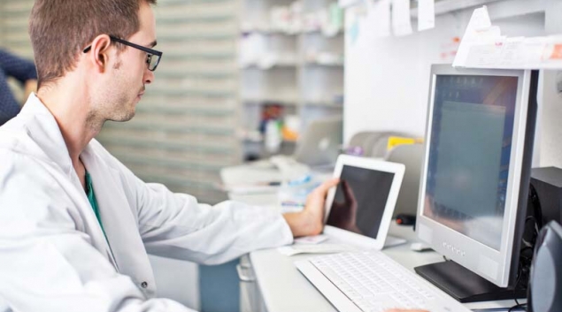 Pharmacist using a tablet