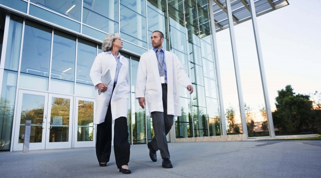 Doctors walking outside of a hospital