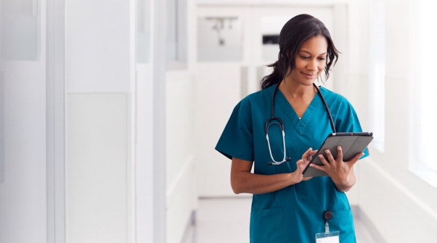 Medical worker looking at tablet