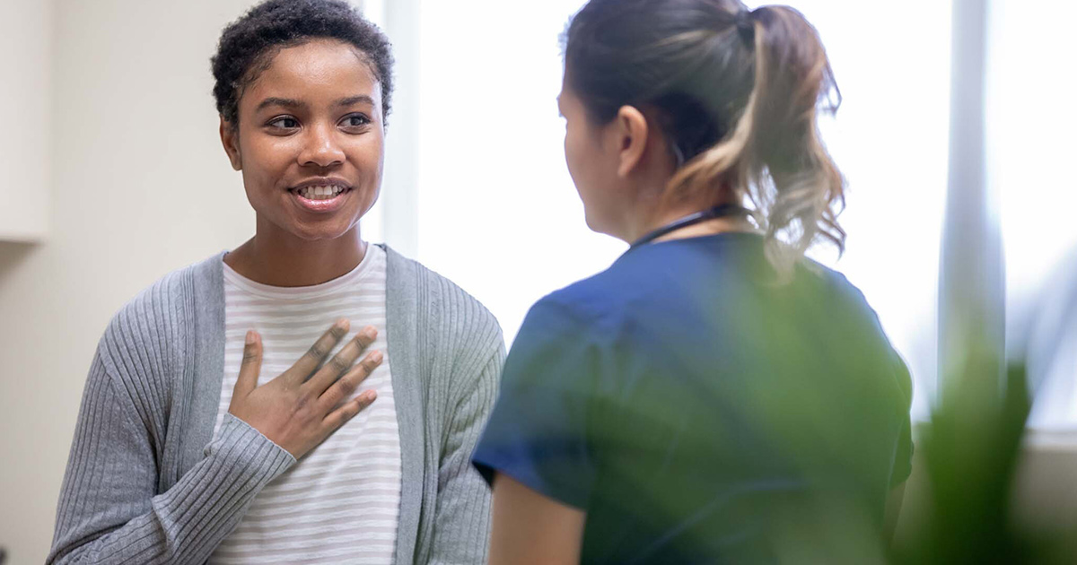 Healthcare worker talking to patient