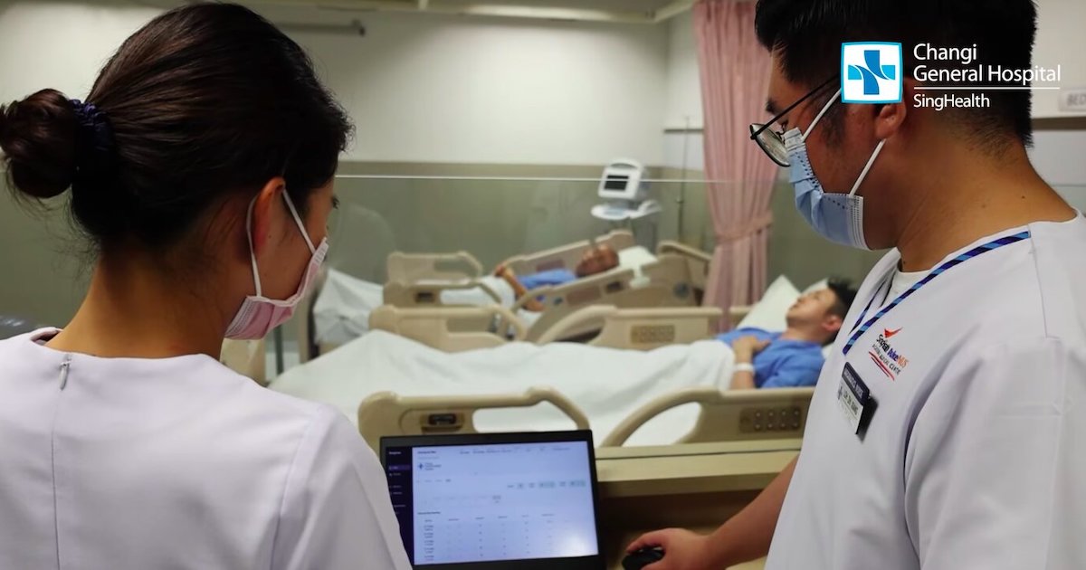 Nurses remotely checking the vital signs of a mock patient through a dashboard