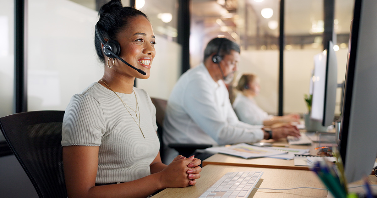 Woman works IT help desk in a support center
