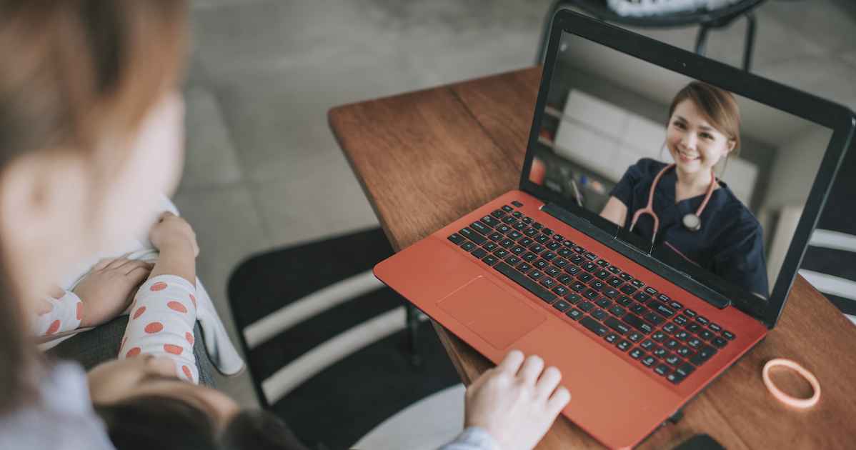 Patient and child talking to doctor on laptop