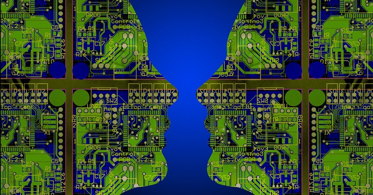 Two faces with computer chips inside look at each other