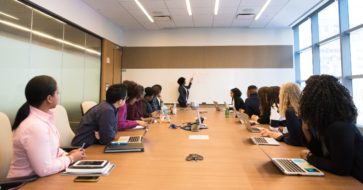 People gathered at a board meeting