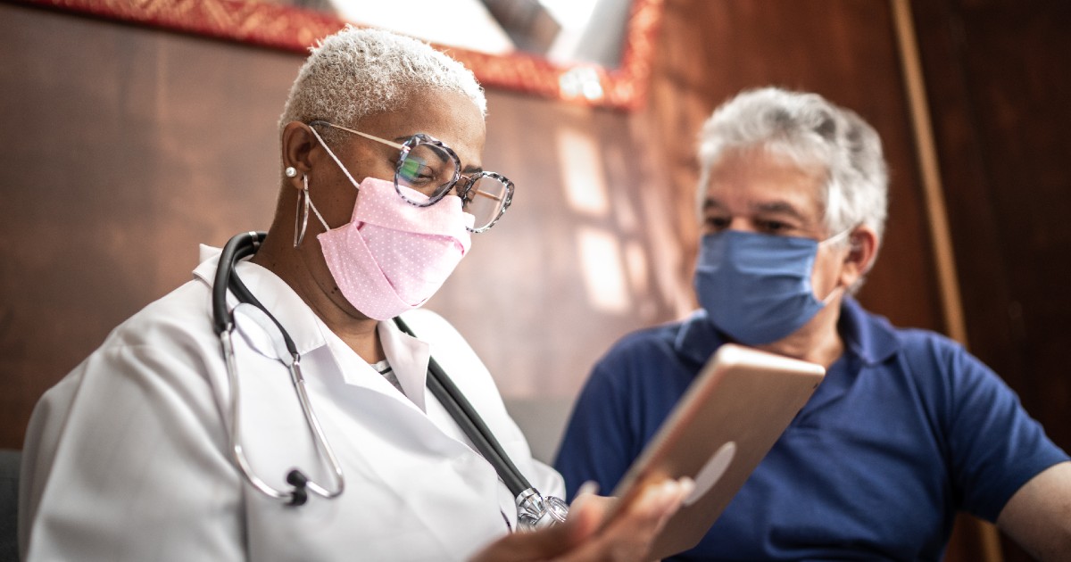 A doctor speaks with a caregiver
