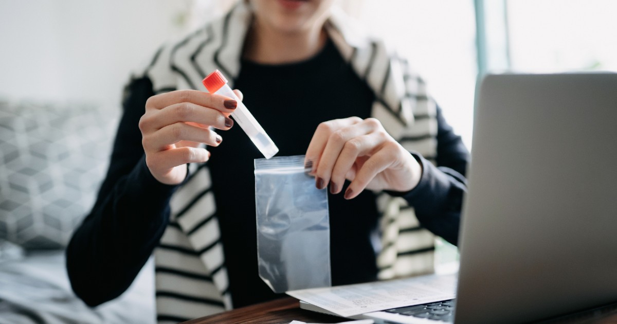A person taking a COVID-19 self test