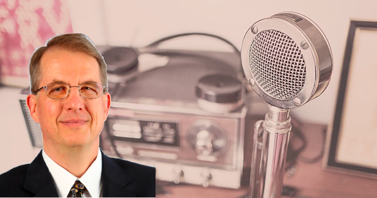 Dan Golder's headshot on a picture of a mic