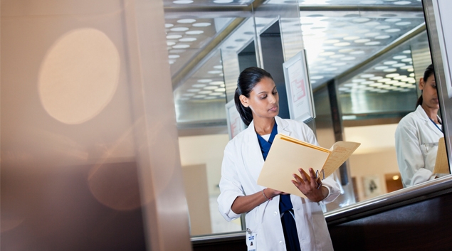 Doctor looking at a folder
