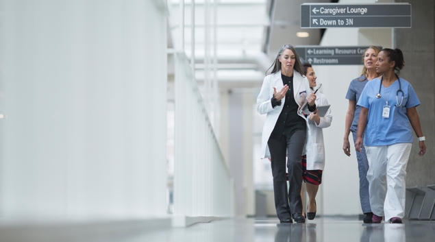Healthcare workers walking in hallway